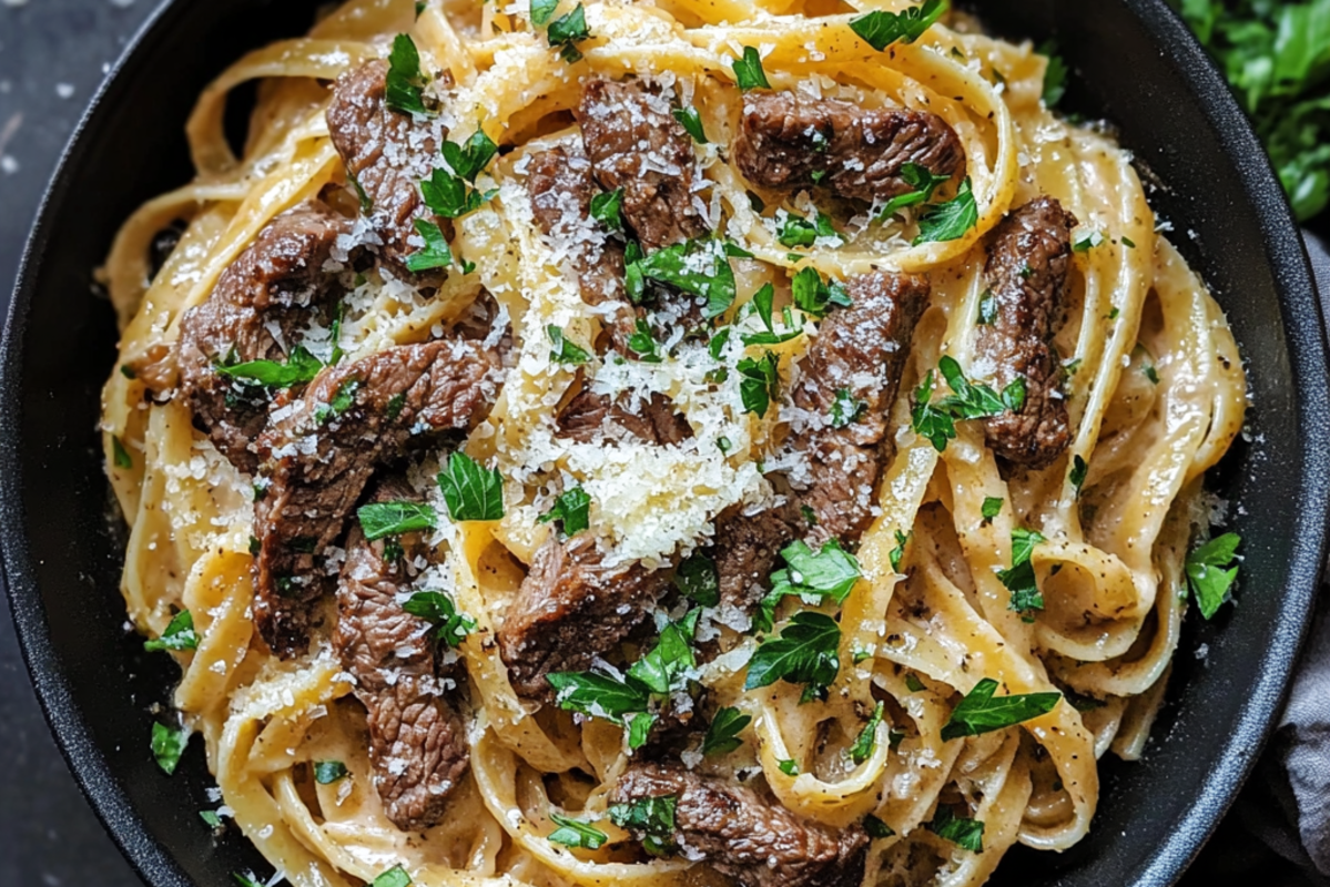 A realistic plate of ground beef pasta with creamy Alfredo sauce, garnished with fresh parsley and Parmesan cheese, served on a wooden table in a cozy kitchen setting.