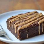 Chocolate protein brownie with almond butter drizzle.