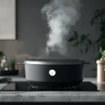 A sleek cocotte cooking a casserole, with steam rising, on a stovetop.