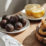 A dessert table featuring cookies, protein balls, and lemon pound cake slices.