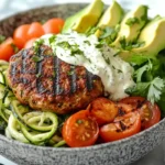 Low-carb burger bowl with zucchini noodles and turkey patty